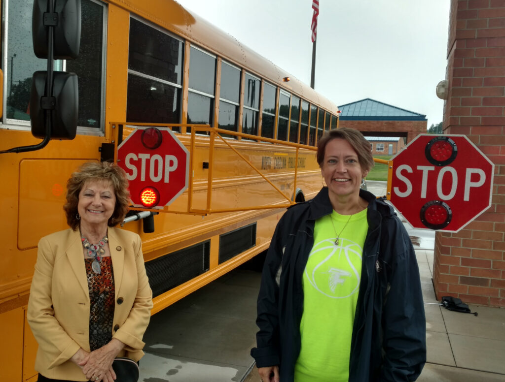 Senator Joyce Krawiec checks out a bus in Yadkin County with an Extended Stop Arm. The extension dramatically decreases the number of vehicles illegally passing stopped school buses.